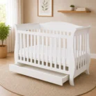 Andy white drop side sleigh baby cot with storage drawer open
