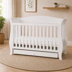 Andy 3-in-1 drop side sleigh baby cot in white nursery scene