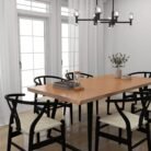 Wooden beveled edge dining table with six chairs in a bright dining room