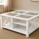 Bridgston style white glass top coffee table with visible internal shelf