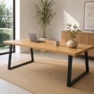 Wooden 2m dining table with black metal legs in a bright modern room